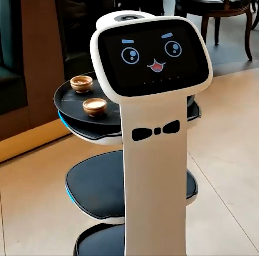 Pristatymo robotas restoranams – autonominis aptarnavimo robotas su interaktyviu ekranu ir kelių lygių padėklais, skirtas maisto ir gėrimų pristatymui restoranuose, mokyklose ar kitose viešose erdvėse