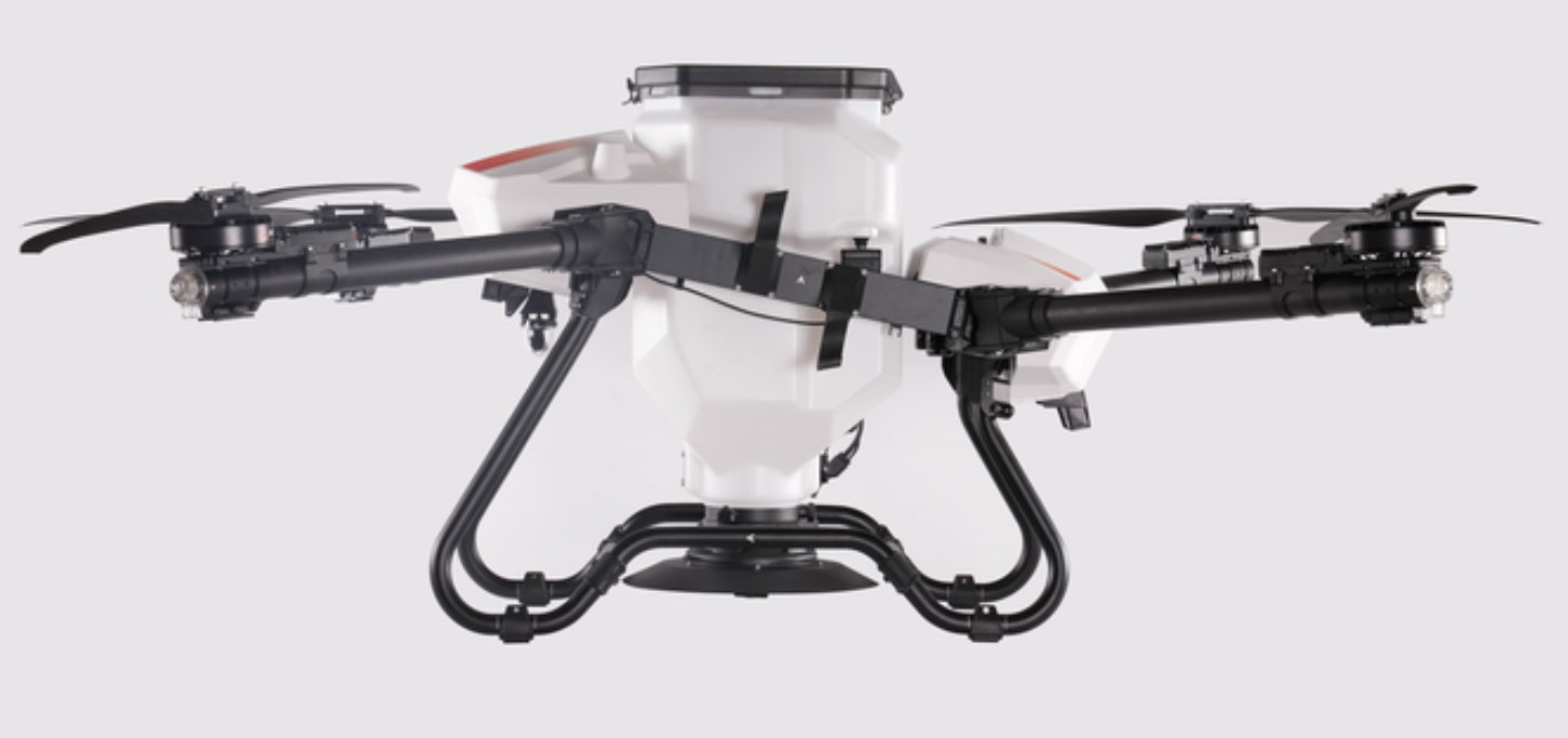 Žemės ūkio dronas su didele barstymo talpa ir tvirta konstrukcija, skirtas tiksliam sėklų ir trąšų paskleidimui.